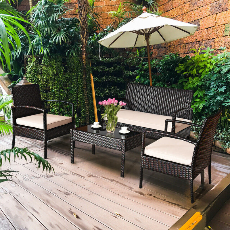 Transform Your Outdoor Space with Our 4-Piece Patio Rattan Conversation Set – Loveseat, Single Sofas, and Glass-Top Coffee Table